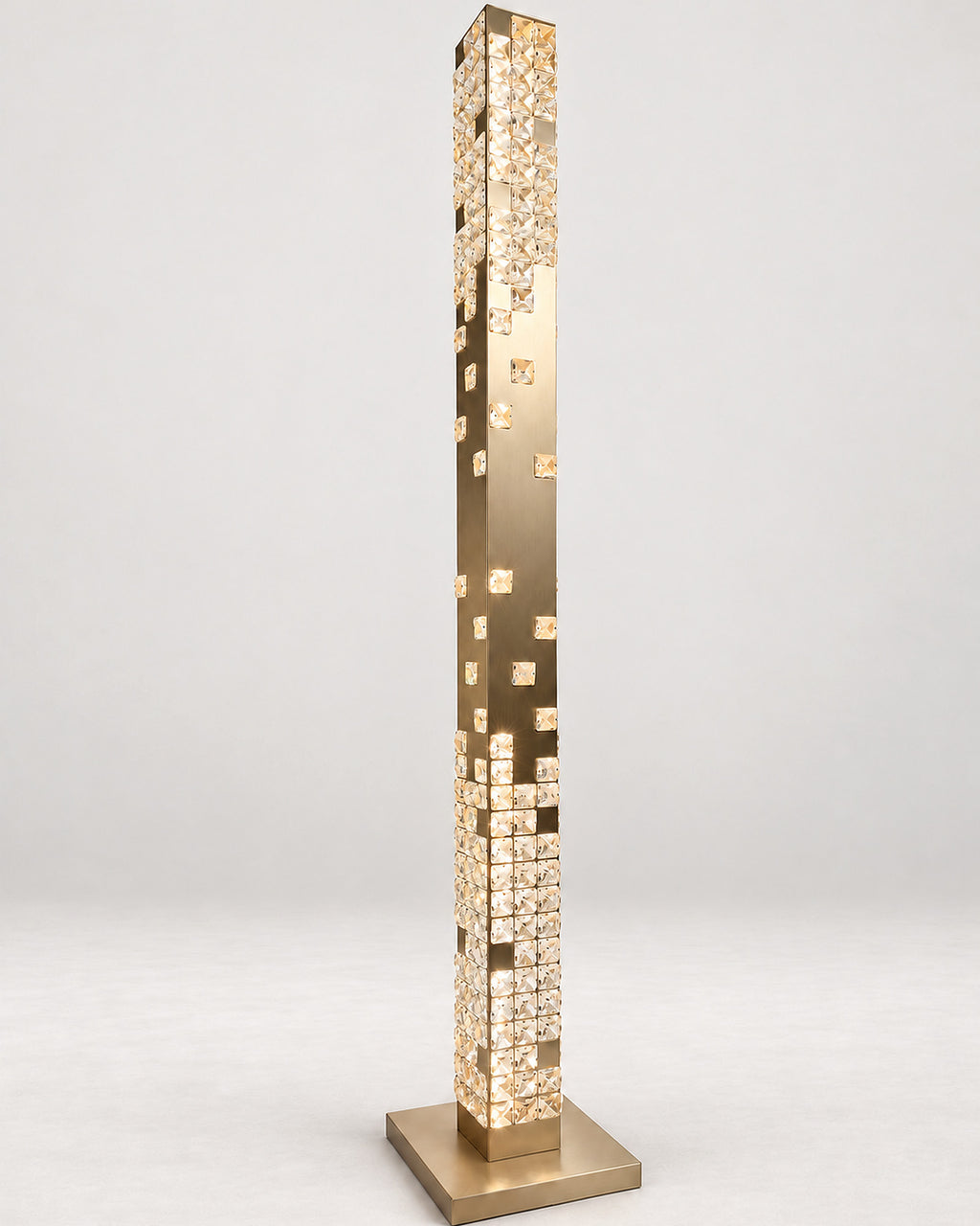Cascade Crystal Tower Floor Lamp in Champagne Gold, illuminated three-quarter view
