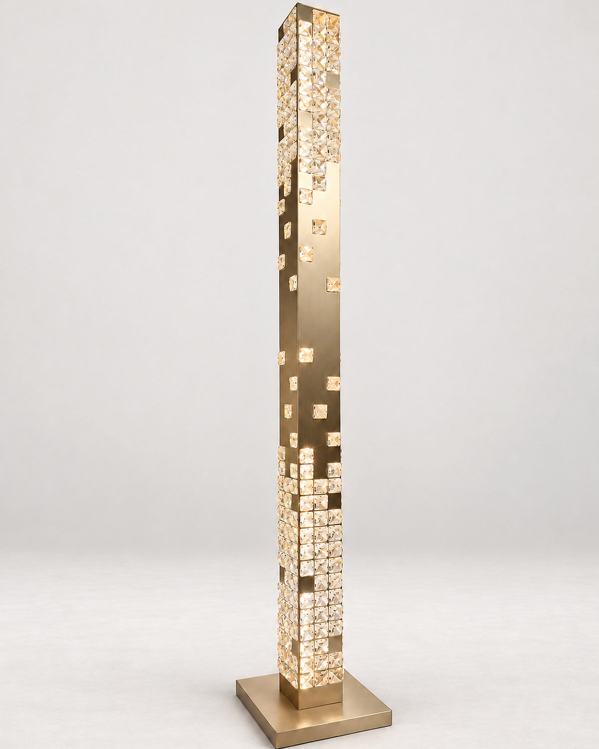 Cascade Crystal Tower Floor Lamp in Champagne Gold, illuminated three-quarter view